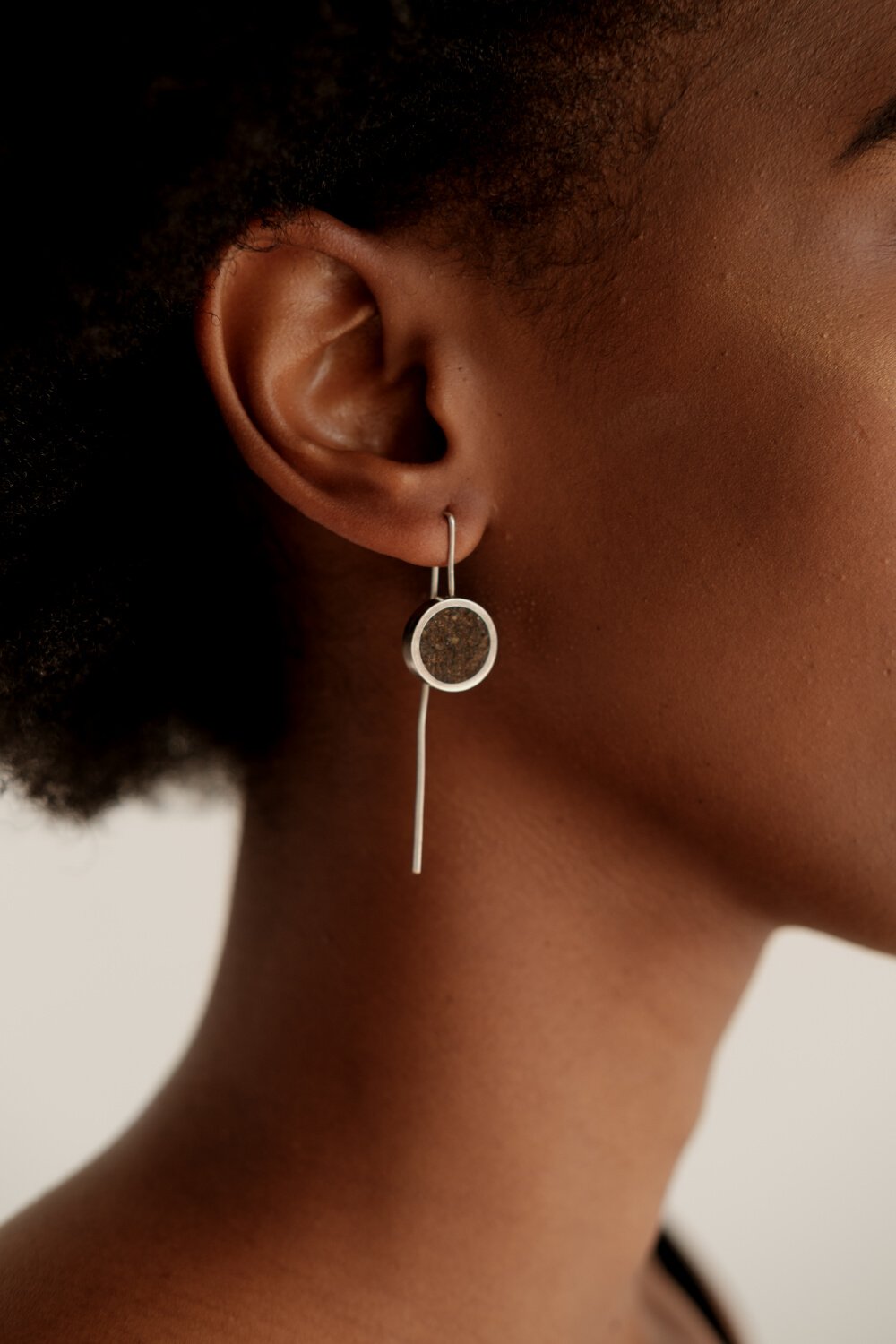 Woman with Minimalist Earrings